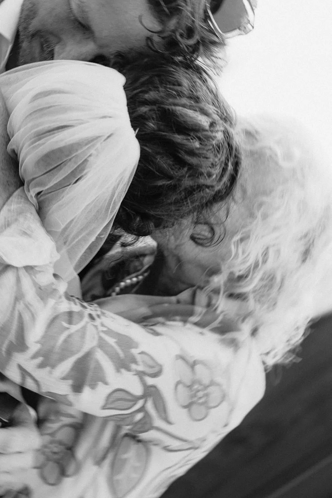 The two of them cheek to cheek with their eyes closed, seen close up